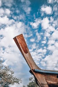 Low angle view of old wooden structure against sky