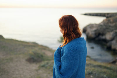 Rear view of woman looking at sea