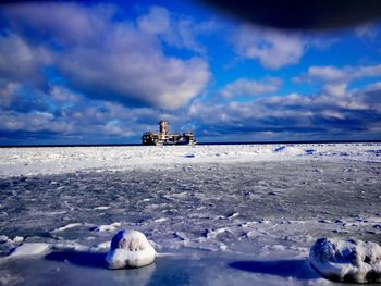 Scenic view of sea against sky during winter
