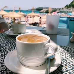 Close-up of coffee cup on table