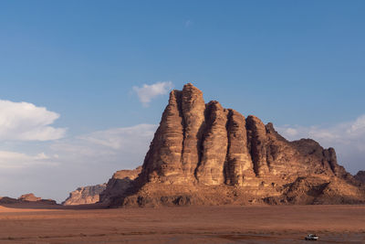 Rock formations on landscape against sky