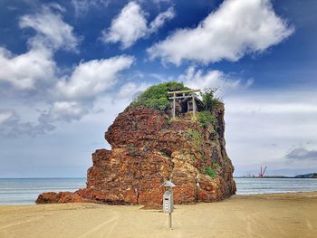 Built structure on beach against sky