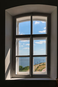 Sea seen through window of building