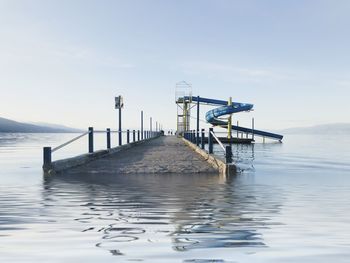 Pier over sea against sky