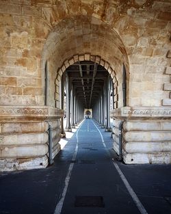 Empty long corridor along columns