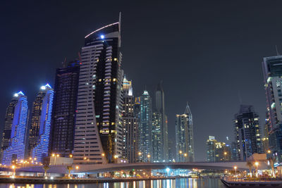 Illuminated buildings in city at night