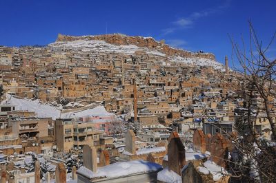 View of townscape against sky during winter