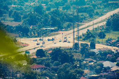 High angle view of trees and buildings in city