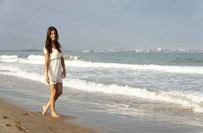 Woman standing on beach