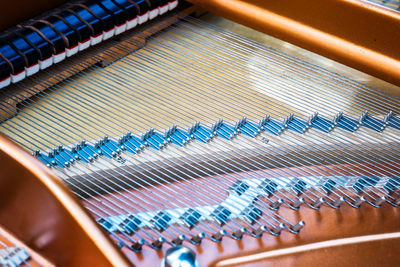 Interior of a grand piano, showing strings and hammers