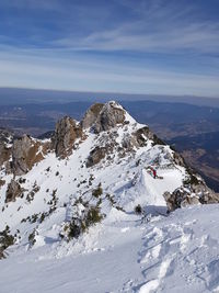 Scenic view of snowcapped mountains against sky