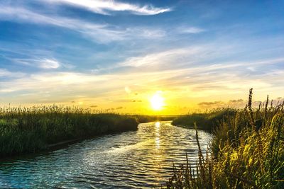 Scenic view of sunset over river