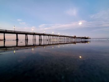 Bridge over sea against sky