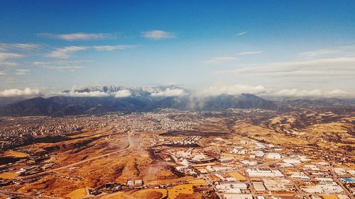 Aerial view of townscape against sky