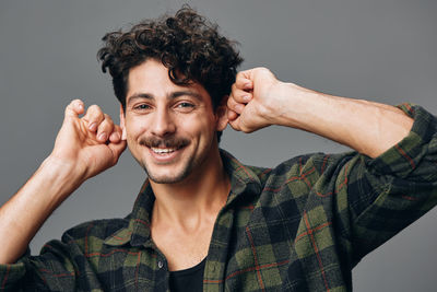 Portrait of young man against white background