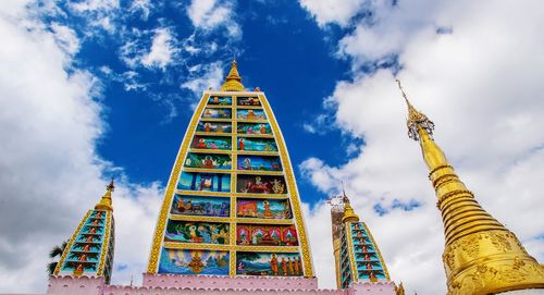 Low angle view of temple against cloudy sky