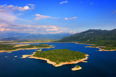 Scenic view of sea against blue sky