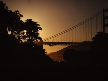 Silhouette of bridge over river
