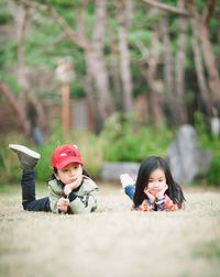 Siblings standing outdoors