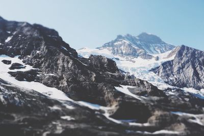 Scenic view of snowcapped mountains against clear sky