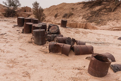 Abandoned empty diesel fuel barrels in the desert of khafs daghrah
