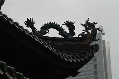 Low angle view of sculpture against clear sky