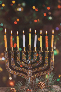 Close-up of illuminated candles on menorah