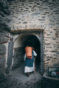 Rear view of woman entering in building