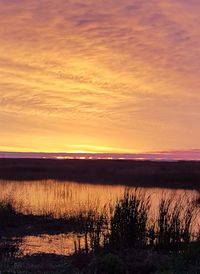 Scenic view of sea against sky at sunset