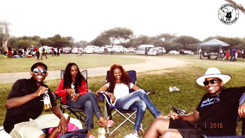 Group of people sitting in park