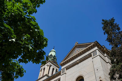 Low angle view of building against clear blue sky