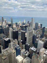 Aerial view of modern buildings in city against sky