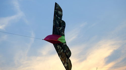 Low angle view of flag against sky