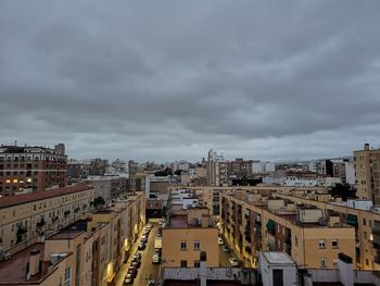 High angle view of buildings in city against sky