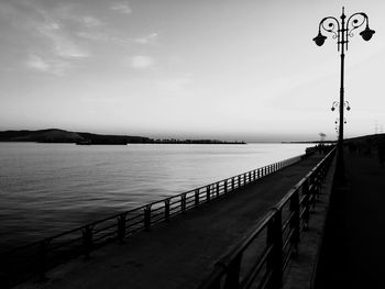 Pier over sea against sky