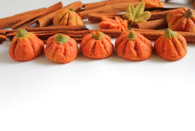 Close-up of pumpkins against white background