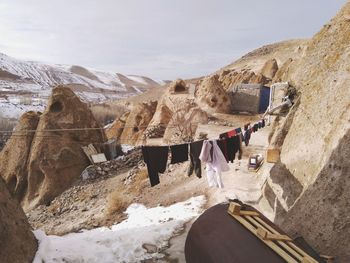 Laundry drying on clothesline by rock formation