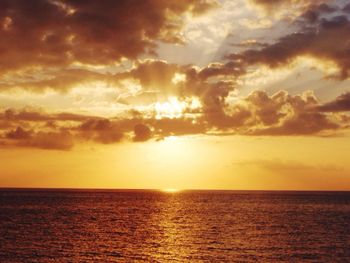 Scenic view of sea against dramatic sky