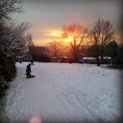 Full length of child in snow during winter