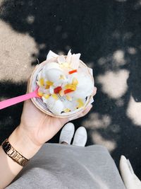 High angle view of person holding ice cream cone