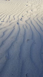 High angle view of snow on sand
