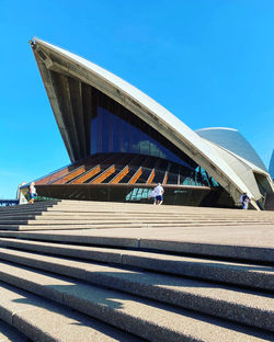 View of modern building against blue sky