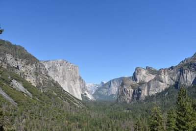 Scenic view of mountains against clear blue sky