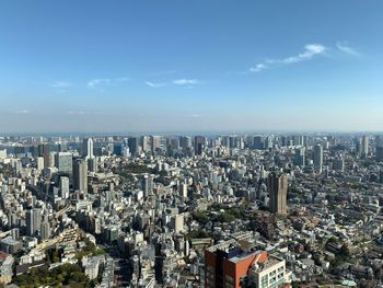 High angle view of city buildings against sky