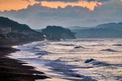 Scenic view of sea against sky during sunrise