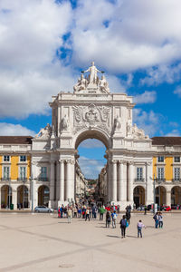 Group of people in front of historical building