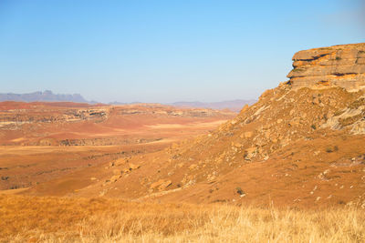 Scenic view of desert against clear sky