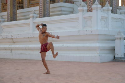 Shirtless man at temple