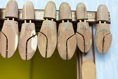 Close-up of clothes hanging on wooden wall