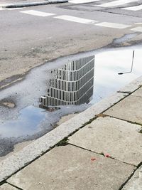 High angle view of puddle on street